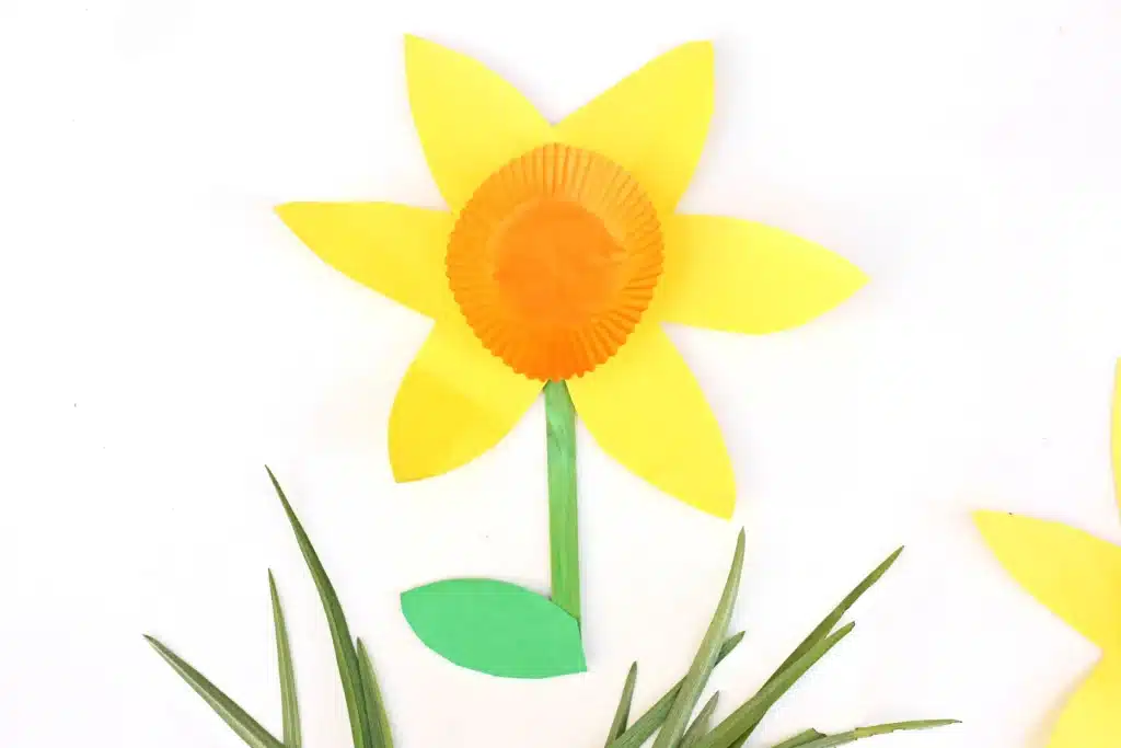 Cupcake Liner Daffodil - Cultivating Brilliant Minds daffodils made out of yellow and green construction paper and an orange cupcake liner