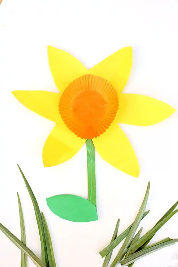 Cupcake Liner Daffodil - Cultivating Brilliant Minds daffodils made out of yellow and green construction paper and an orange cupcake liner