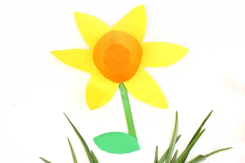 Cupcake Liner Daffodil - Cultivating Brilliant Minds daffodils made out of yellow and green construction paper and an orange cupcake liner