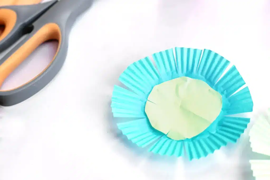 Magic Jelly Bean Easter activity for kids - Cultivating Brilliant Minds a cupcake liner cut to look like a flower