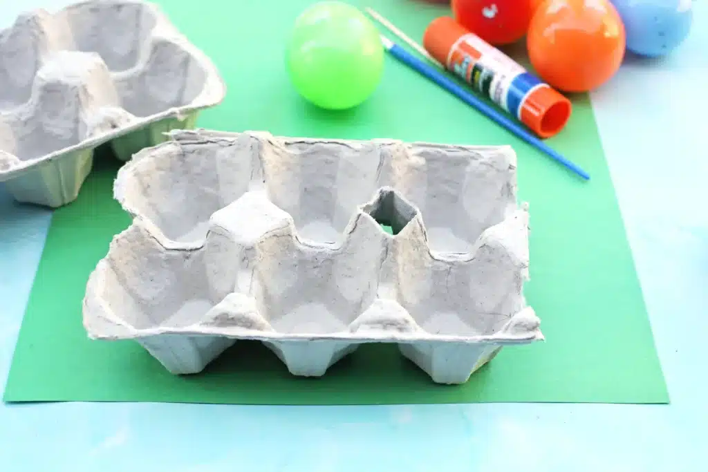 Easter Egg Garden Craft - Cultivating Brilliant Minds an egg carton on green paper