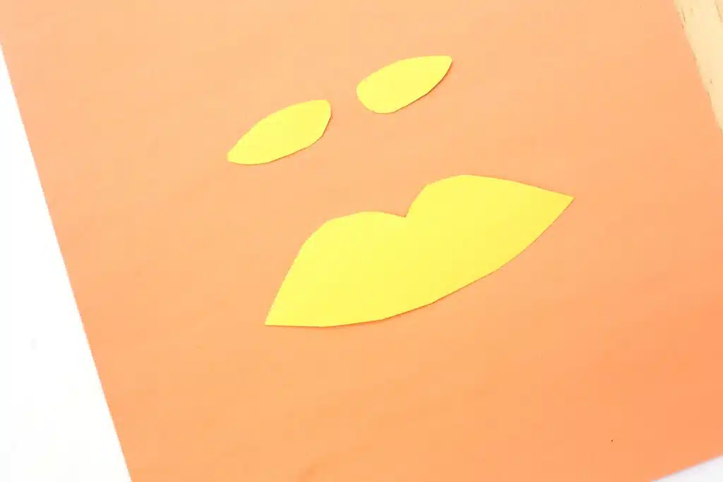 Dr. Seuss The Lorax Juice Boxes - Cultivating Brilliant Minds a mustache and eyebrows cut out of yellow construction paper