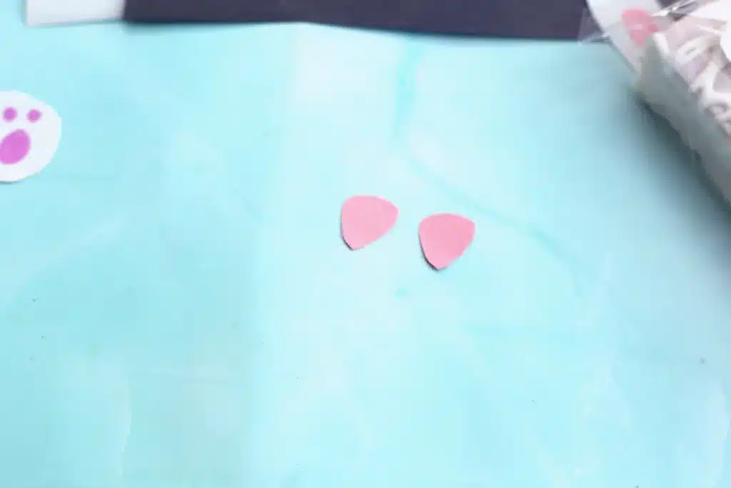 Little Debbie Easter Bunny Cakes - Cultivating Brilliant Minds triangles cut out of pink construction paper