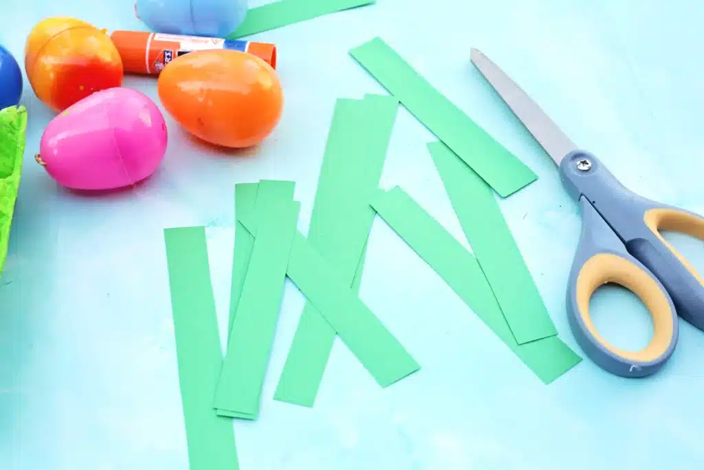 Easter Egg Garden Craft - Cultivating Brilliant Minds strips of green construction paper