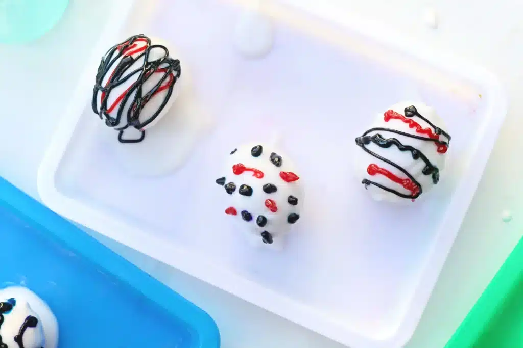 Galaxy Easter Eggs - Cultivating Brilliant Minds an easter egg covered in a baking soda paste with colored food coloring decorations on top