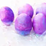 Galaxy Easter Eggs - Cultivating Brilliant Minds easter eggs dyed to look like a galaxy with gold glitter
