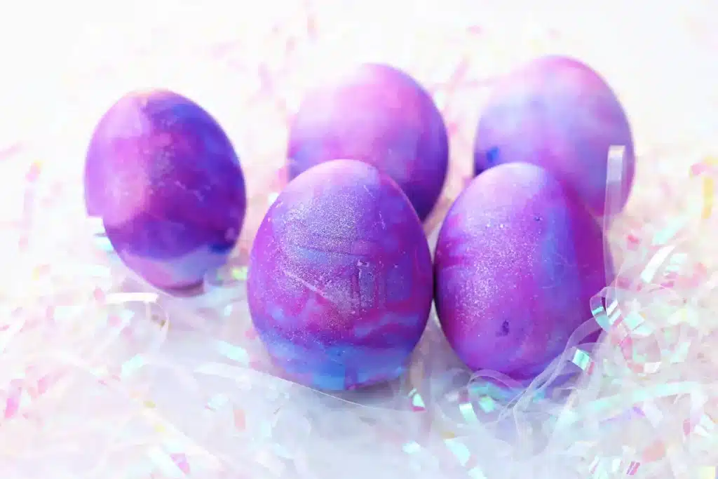 Galaxy Easter Eggs - Cultivating Brilliant Minds easter eggs dyed to look like a galaxy with gold glitter