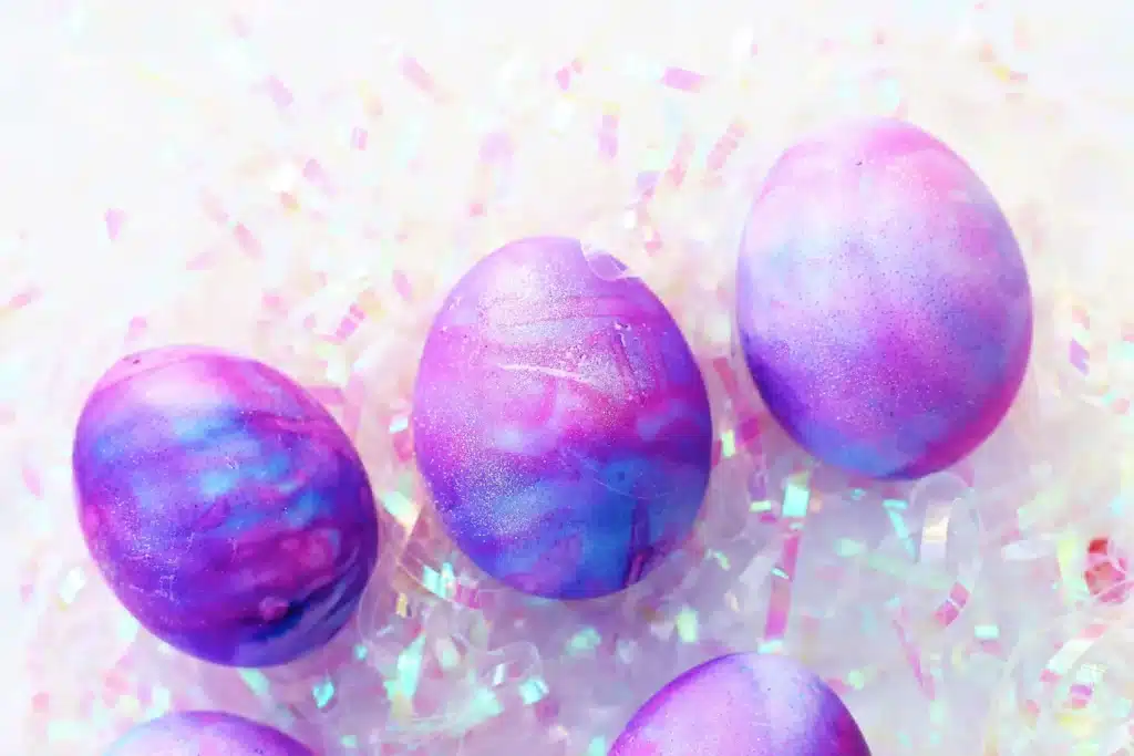 Galaxy Easter Eggs - Cultivating Brilliant Minds easter eggs dyed to look like a galaxy with gold glitter