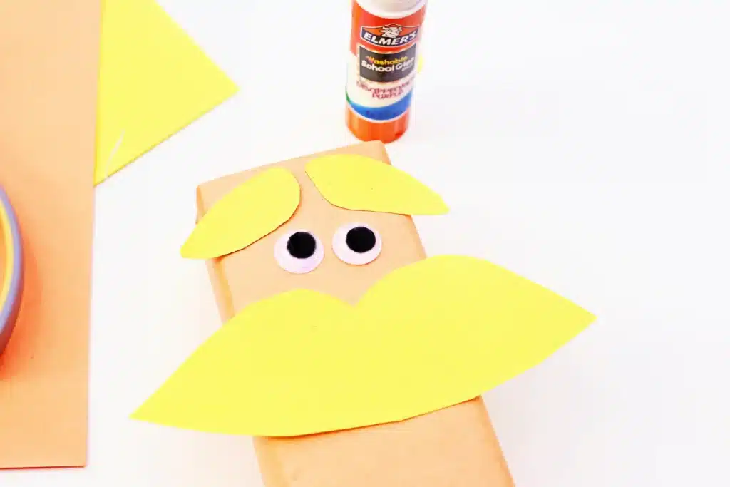 Dr. Seuss The Lorax Juice Boxes - Cultivating Brilliant Minds juice boxes wrapped in orange paper and decorated to look like The Lorax