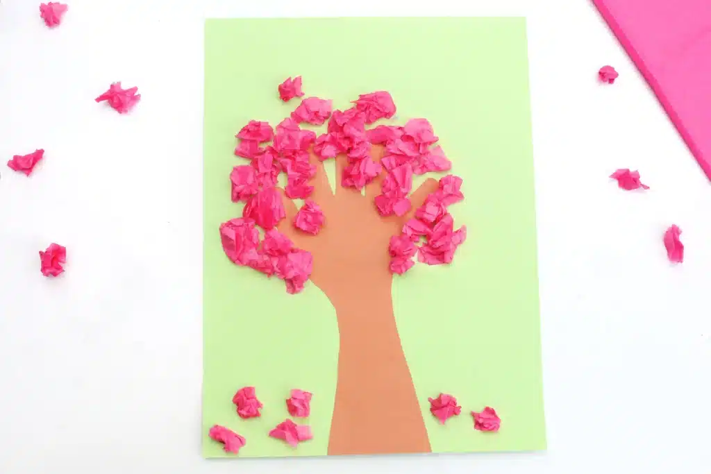 Handprint Cherry Blossom Tree - Cultivating Brilliant Minds a handprint cherry blossom tree that uses a handprint as the trunk and crumbled pink tissue paper as the cherry blossoms