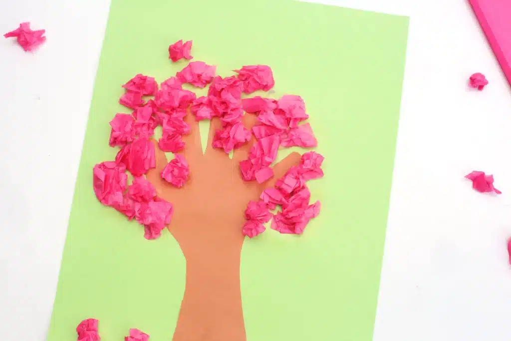 Handprint Cherry Blossom Tree - Cultivating Brilliant Minds a handprint cherry blossom tree that uses a handprint as the trunk and crumbled pink tissue paper as the cherry blossoms
