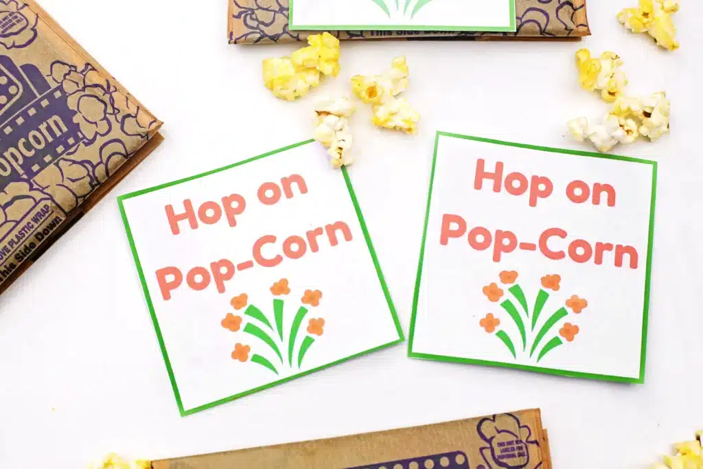 Dr. Seuss Hop on Pop-Corn Printable - Cultivating Brilliant Minds popcorn next to a printable that reads "hop on pop-corn"