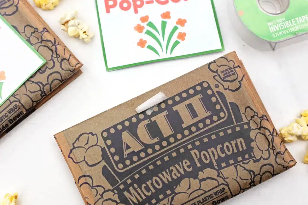 Dr. Seuss Hop on Pop-Corn Printable - Cultivating Brilliant Minds popcorn next to a printable that reads "hop on pop-corn"