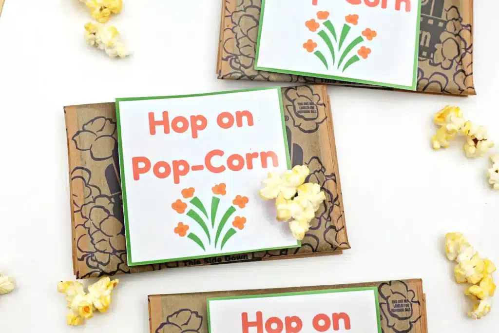 Dr. Seuss Hop on Pop-Corn Printable - Cultivating Brilliant Minds popcorn next to a printable that reads "hop on pop-corn"