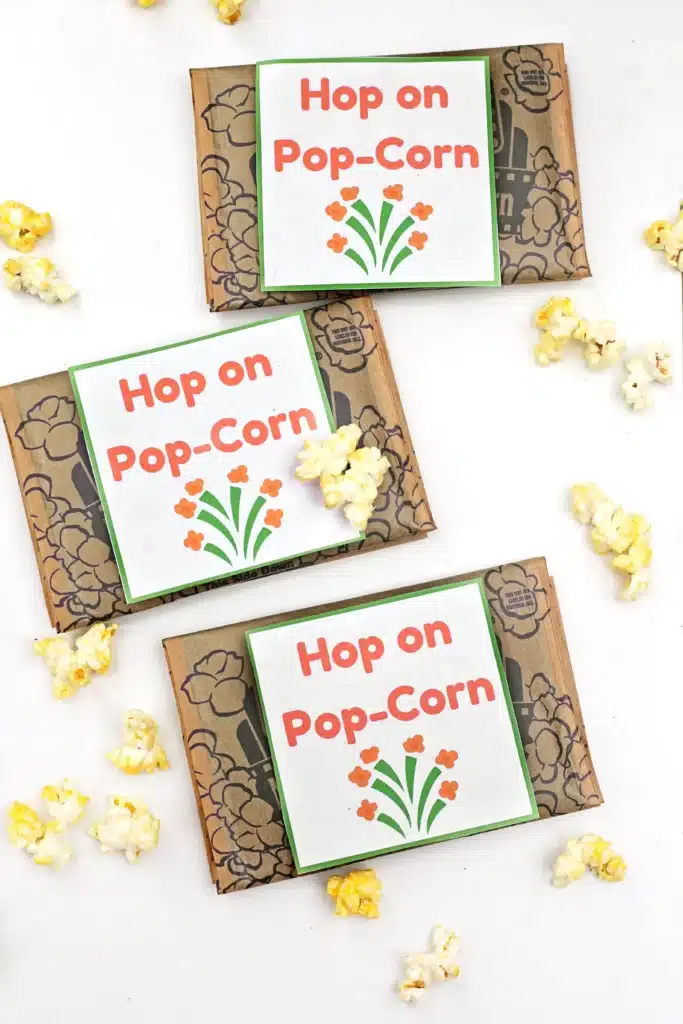 Dr. Seuss Hop on Pop-Corn Printable - Cultivating Brilliant Minds popcorn next to a printable that reads "hop on pop-corn"