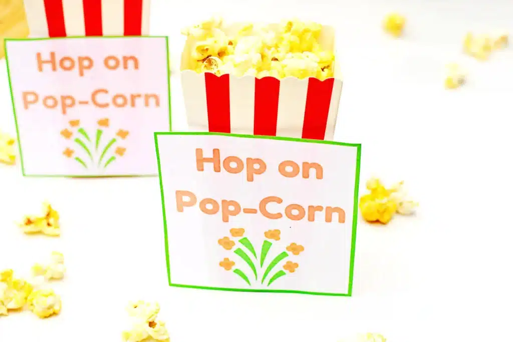 Dr. Seuss Hop on Pop-Corn Printable - Cultivating Brilliant Minds popcorn next to a printable that reads "hop on pop-corn"