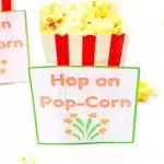 popcorn next to a printable that reads "hop on pop-corn"