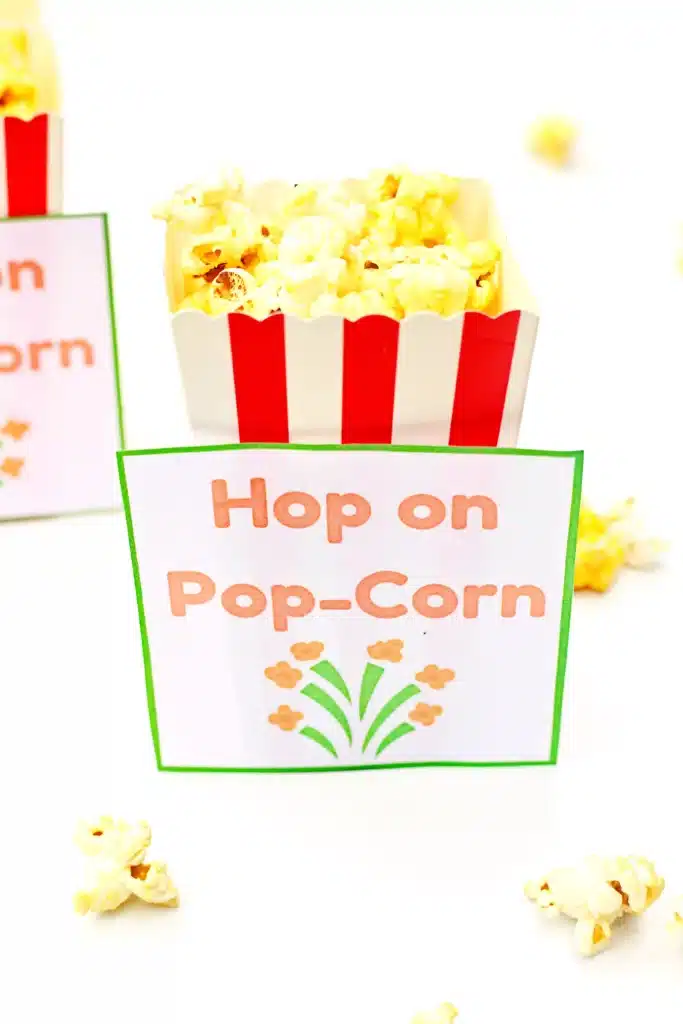 Dr. Seuss Hop on Pop-Corn Printable - Cultivating Brilliant Minds popcorn next to a printable that reads "hop on pop-corn"