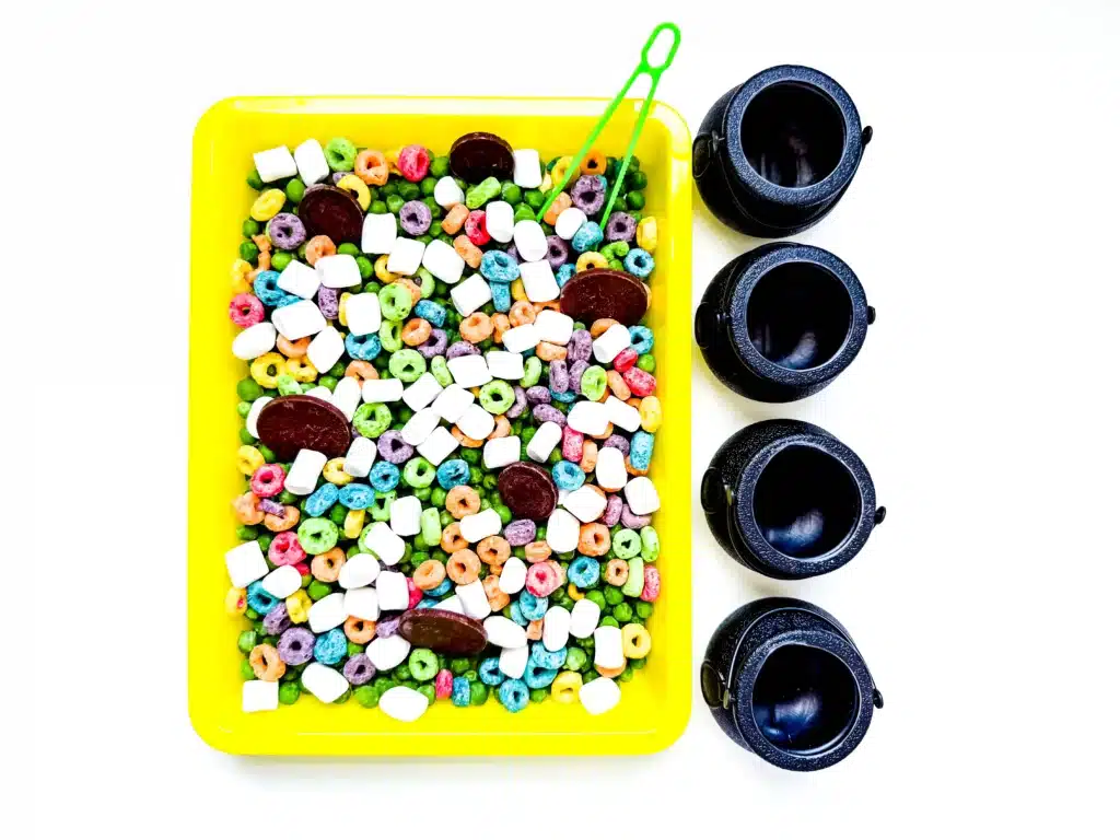 Edible St. Patrick's Day Sensory Bin - Cultivating Brilliant Minds a st. patrick's day sensory bin that has green peas, froot loops, marshmallows, and chocolate coins.
