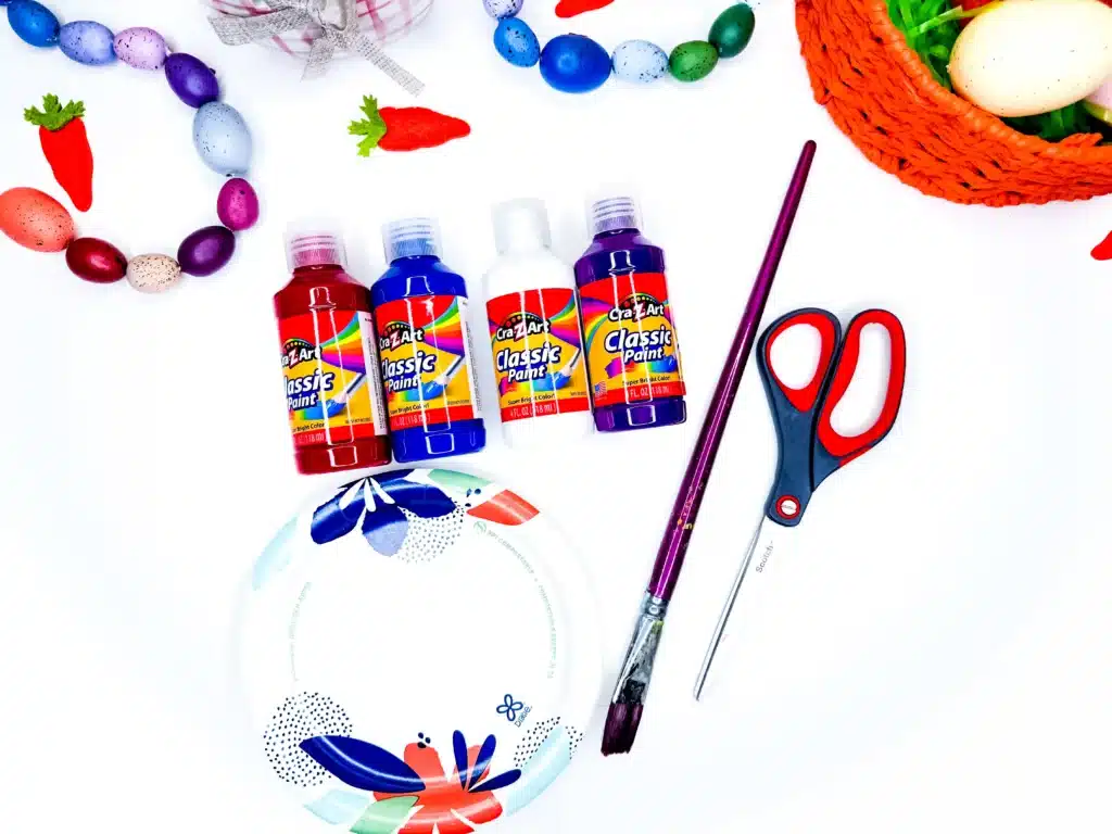 Bunny Handprint Craft For Easter - Cultivating Brilliant Minds paint, paintbrush, paper plate, white paper, and scissors