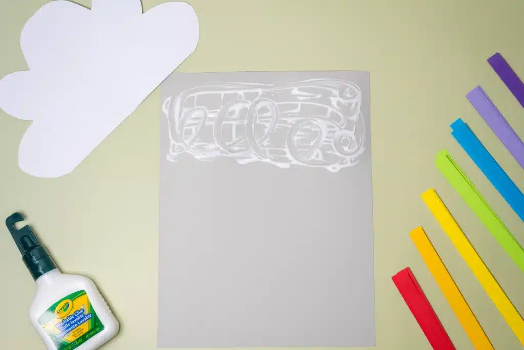 Rainbow Cloud Craft - Cultivating Brilliant Minds glue on a piece of paper