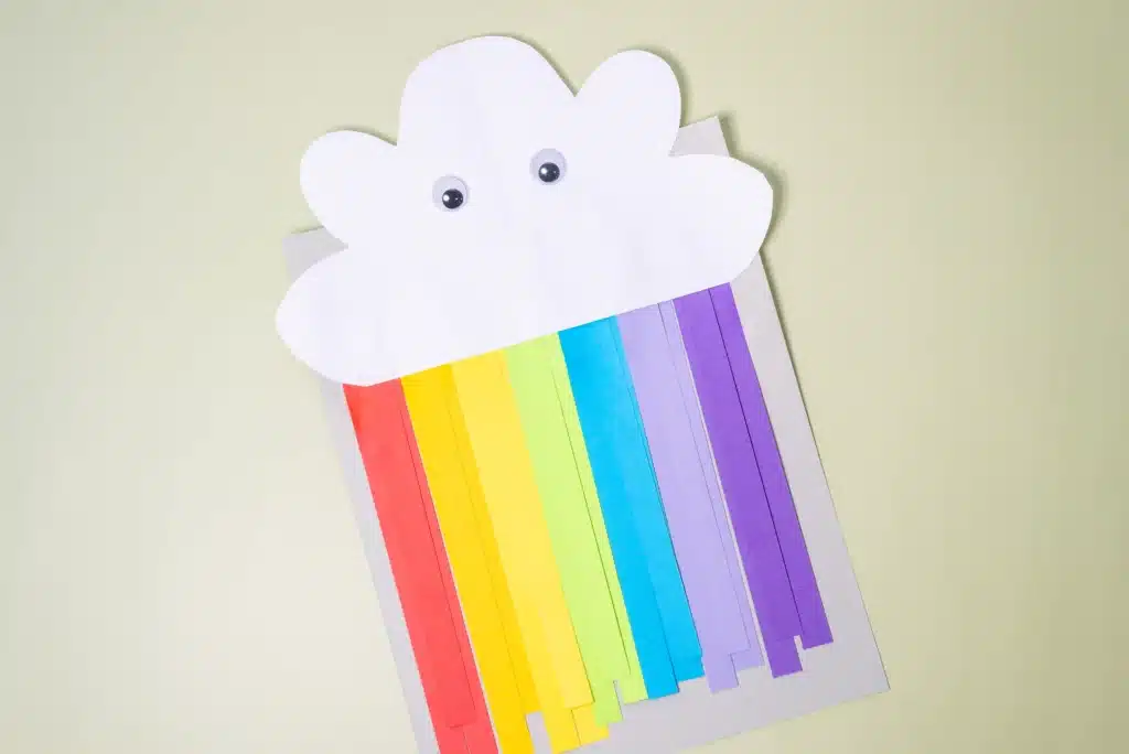 Rainbow Cloud Craft - Cultivating Brilliant Minds a rainbow cloud craft that is made out of construction paper