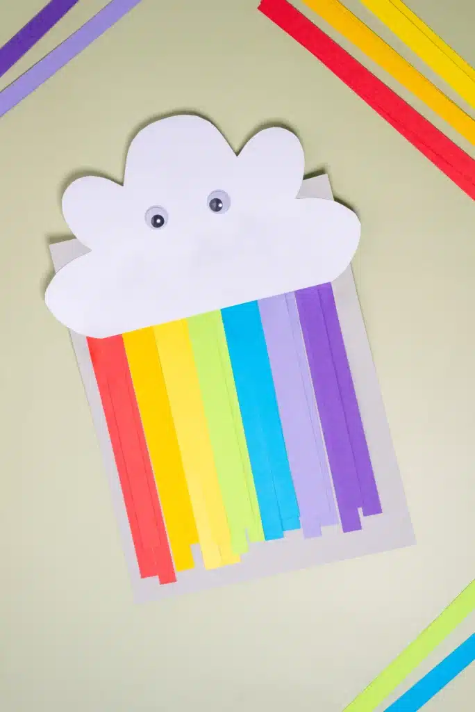 Rainbow Cloud Craft - Cultivating Brilliant Minds a rainbow cloud craft that is made out of construction paper