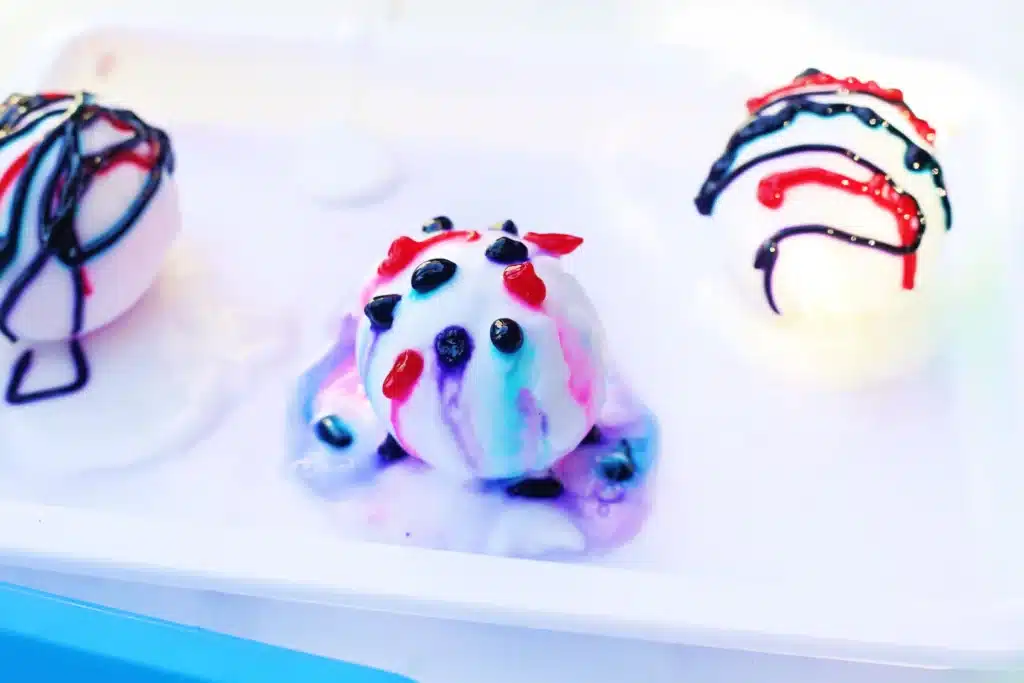 Galaxy Easter Eggs - Cultivating Brilliant Minds vinegar on an egg covered in baking soda paste and food coloring