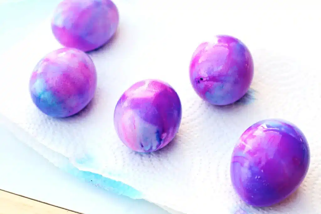 Galaxy Easter Eggs - Cultivating Brilliant Minds easter eggs dyed to look like a galaxy with gold glitter
