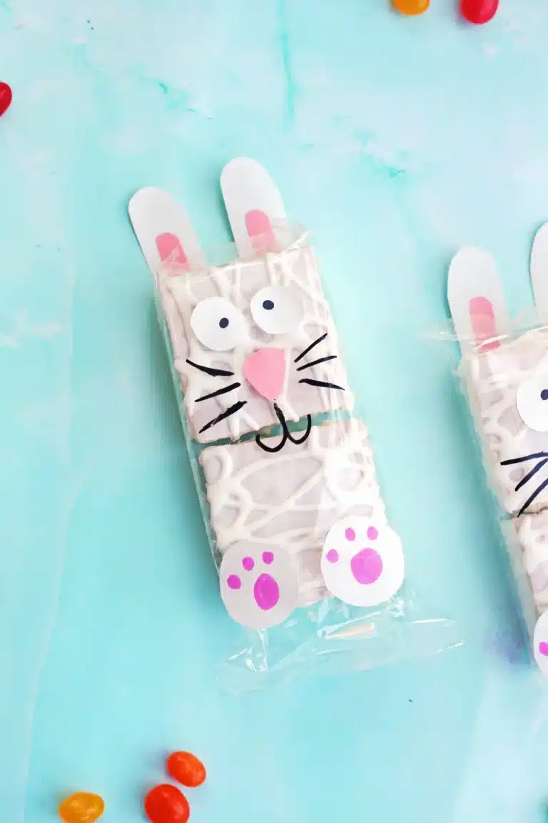 Little Debbie Easter Bunny Cakes that have construction paper bunny faces, feet, and ears glued onto the wrapper