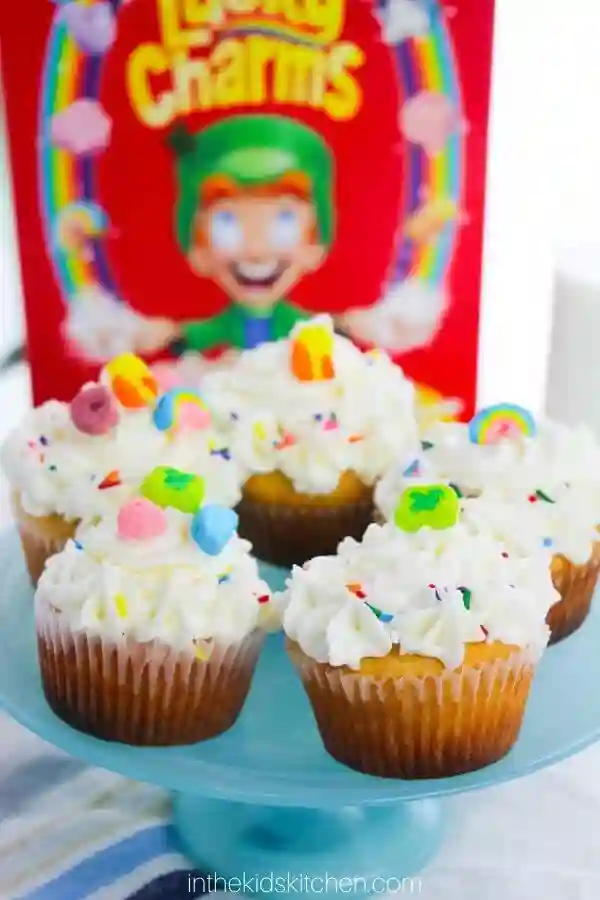 St. Patrick's Day Treats for Kids - Cultivating Brilliant Minds lucky charms cupcakes that have sprinkles and lucky charms marshmallows on top
