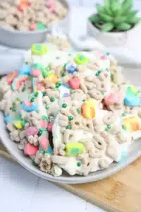 lucky charms bark with white chocolate, lucky charms cereal, and green sprinkles