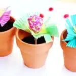 Magic Jelly Bean Easter activity for kids - Cultivating Brilliant Minds a lollipop in a pot of soil