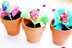 a lollipop in a pot of soil