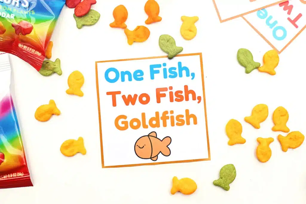 Dr. Seuss One Fish Two Fish Goldfish Printable - Cultivating Brilliant Minds goldfish with a printable sign on it that says "one fish, two fish, goldfish"