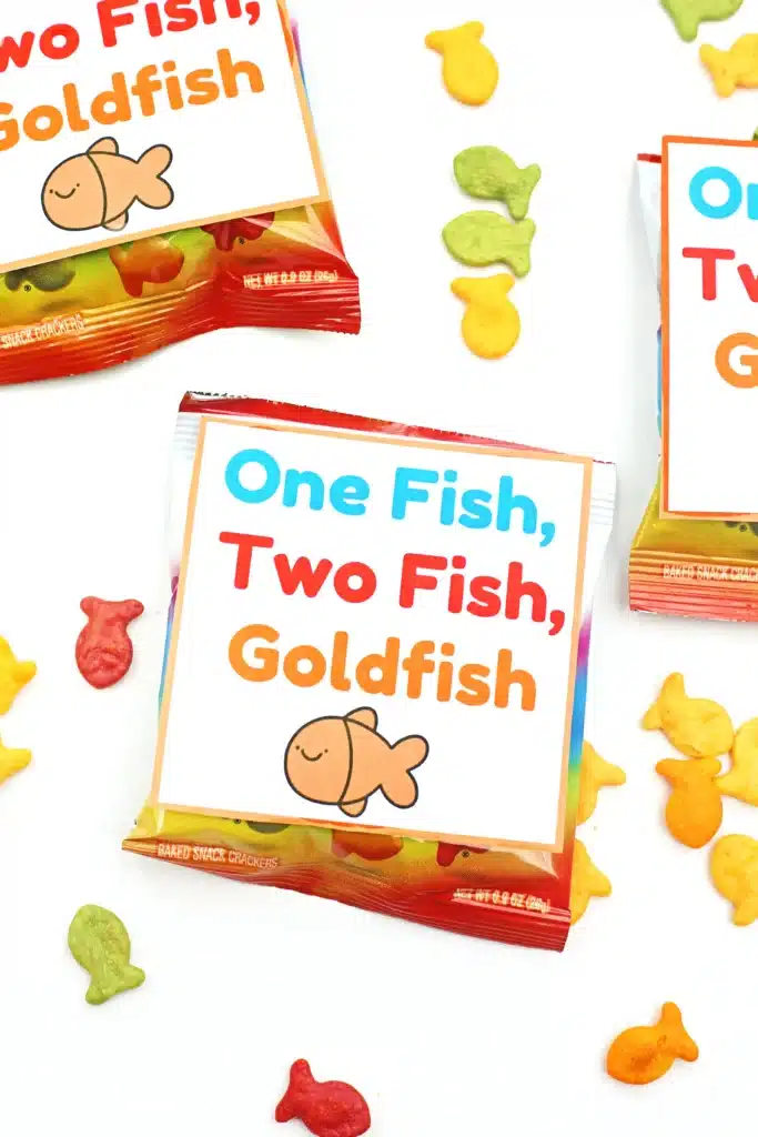 Dr. Seuss One Fish Two Fish Goldfish Printable - Cultivating Brilliant Minds a bag of goldfish with a printable sign on it that says "one fish, two fish, goldfish"