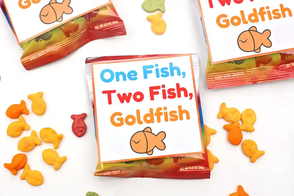 Dr. Seuss One Fish Two Fish Goldfish Printable - Cultivating Brilliant Minds a bag of goldfish with a printable sign on it that says "one fish, two fish, goldfish"