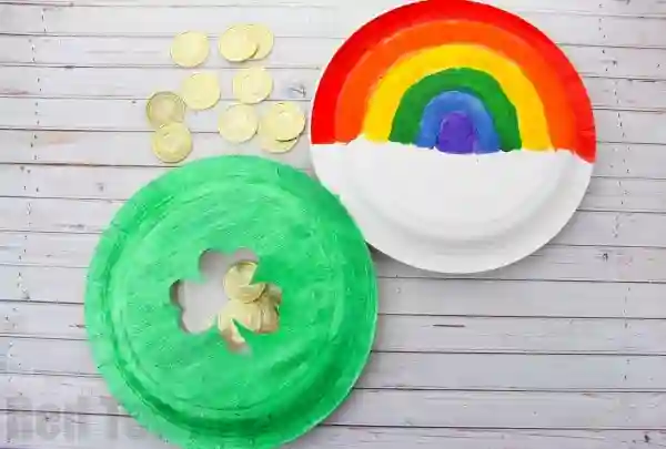 St. Patrick's Day Paper Plate Crafts - Cultivating Brilliant Minds paper plates decorated to look like a rainbow and a shamrock and glued together to make a tambourine