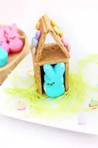 a Peeps House STEM Challenge that uses graham crackers, icing, and m&ms to build a house for a peeps bunny