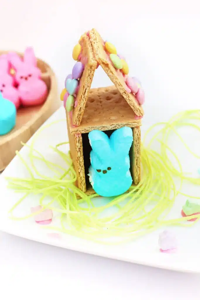 Peeps House STEM Challenge - Cultivating Brilliant Minds a Peeps House STEM Challenge that uses graham crackers, icing, and m&ms to build a house for a peeps bunny