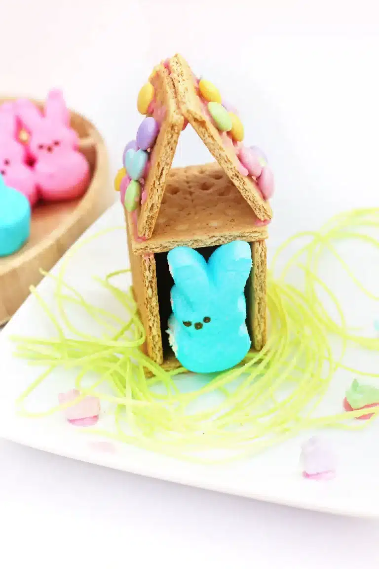 a Peeps House STEM Challenge that uses graham crackers, icing, and m&ms to build a house for a peeps bunny