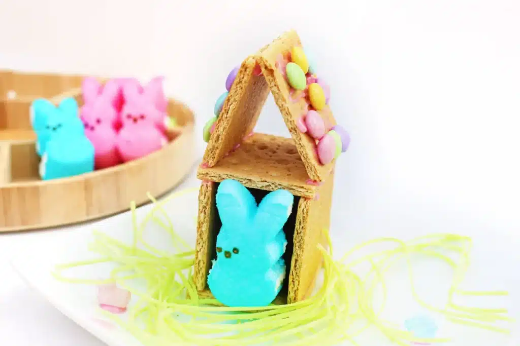 Peeps House STEM Challenge - Cultivating Brilliant Minds a Peeps House STEM Challenge that uses graham crackers, icing, and m&ms to build a house for a peeps bunny