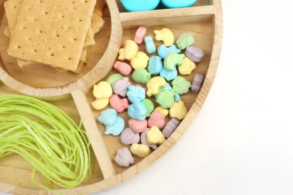 Peeps House STEM Challenge - Cultivating Brilliant Minds peeps, graham crackers, icing, edible easter grass, pastel m&ms, and easter sprinkles