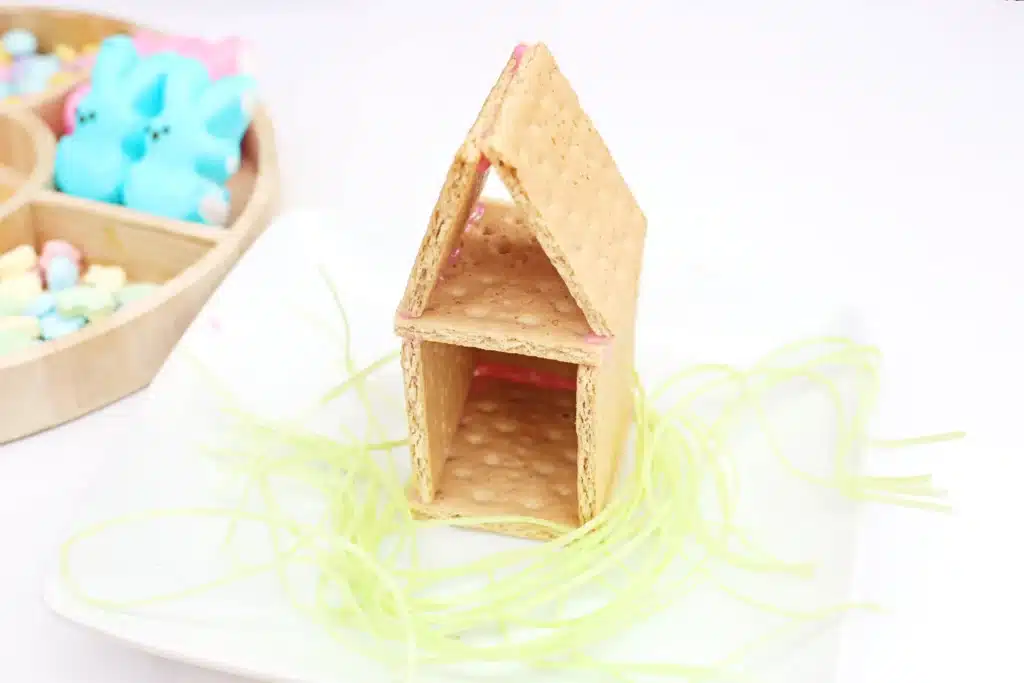 Peeps House STEM Challenge - Cultivating Brilliant Minds a house made out of graham crackers stuck together with icing