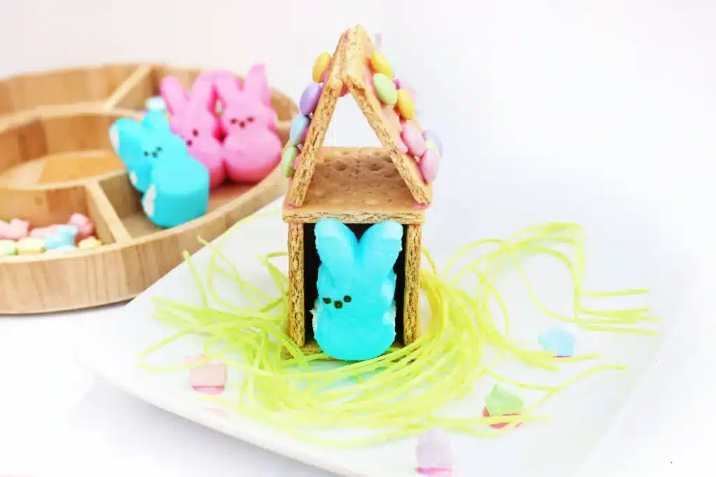 Peeps House STEM Challenge - Cultivating Brilliant Minds a Peeps House STEM Challenge that uses graham crackers, icing, and m&ms to build a house for a peeps bunny