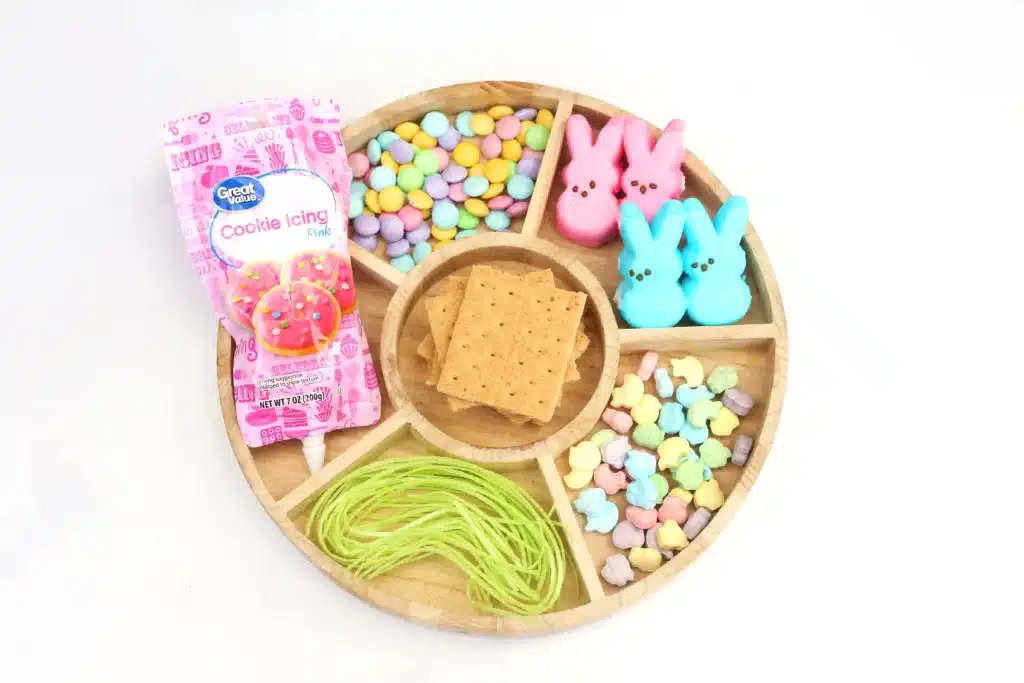 Peeps House STEM Challenge - Cultivating Brilliant Minds peeps, graham crackers, icing, edible easter grass, pastel m&ms, and easter sprinkles