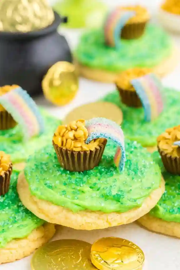 St. Patrick's Day Treats for Kids - Cultivating Brilliant Minds cookies with green icing and a pot of gold and rainbow strip