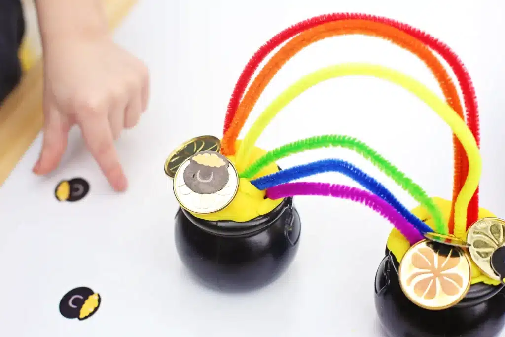 Pot of Gold Playdough Tray - Cultivating Brilliant Minds This pot of gold playdough tray turns pretend play into a golden St. Patrick’s Day sensory activity for kids. With yellow playdough “gold,” tiny pots, rainbow pipe cleaners, and shiny coins, kids get hands-on fine motor practice while building their own pots of gold at the end of the rainbow. Perfect for preschool and early elementary St. Patrick’s Day activities, sensory trays, and playful learning at home or in the classroom.
