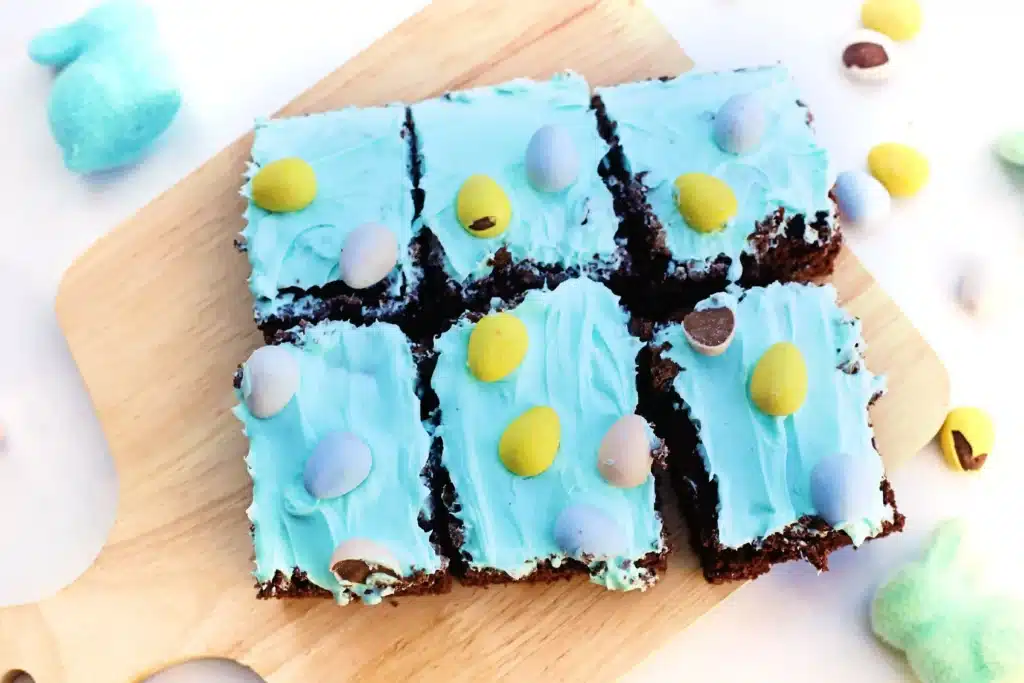 Robin Egg Brownies - Cultivating Brilliant Minds brownies with blue icing and mini cadbury eggs