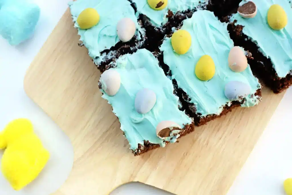 Robin Egg Brownies - Cultivating Brilliant Minds brownies with blue icing and mini cadbury eggs